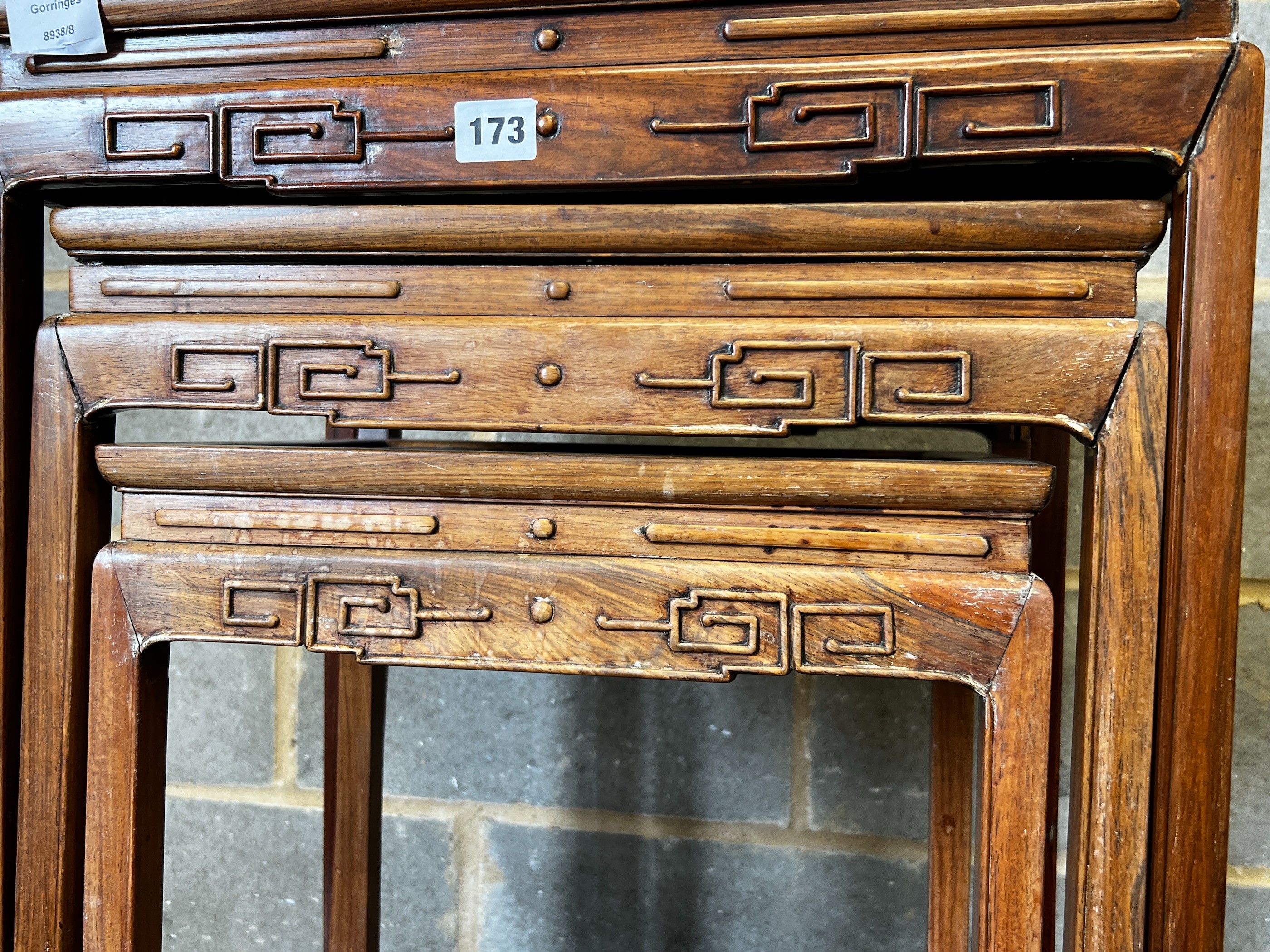 A nest of three Chinese rectangular hardwood tea tables, width 49cm, depth 35cm, height 59cm